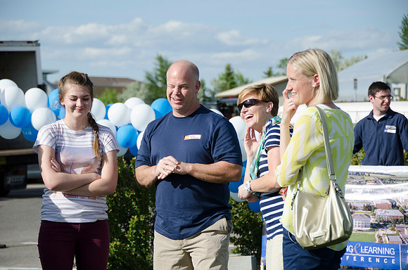 Online instructors gather with their families for an eveing of BBQ and games.