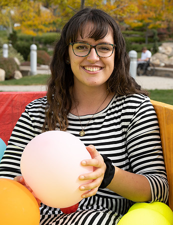 Students who volunteer to participate sit in the ball pit and ask each other questions which are found on the balloons. Video is being produced for Student Living.