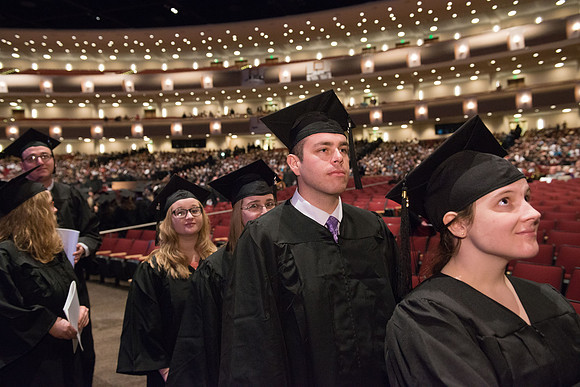 Commencement - Recessional, graduates file out of the BYU-Idaho Center.  Dec 2017
