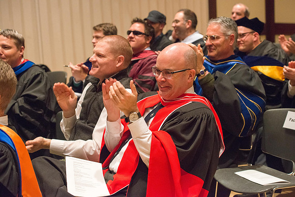 Convocation for College of Language and Letters.  Faculty applaud the graduates.