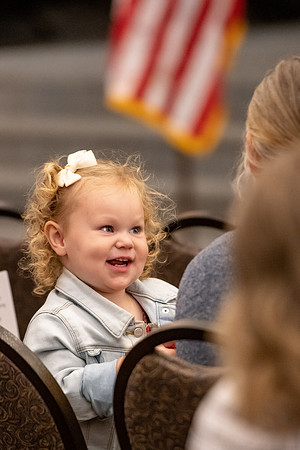 Four graduates from the BYU-Idaho ROTC program gather with the families and have a ceremonial commissioning.