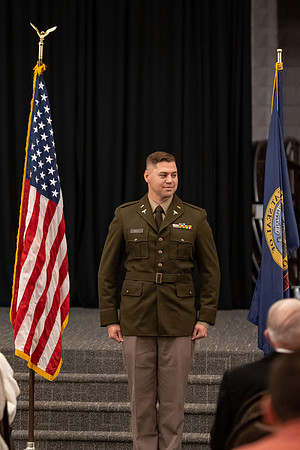 Four graduates from the BYU-Idaho ROTC program gather with the families and have a ceremonial commissioning.