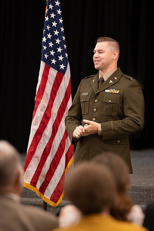 Four graduates from the BYU-Idaho ROTC program gather with the families and have a ceremonial commissioning.