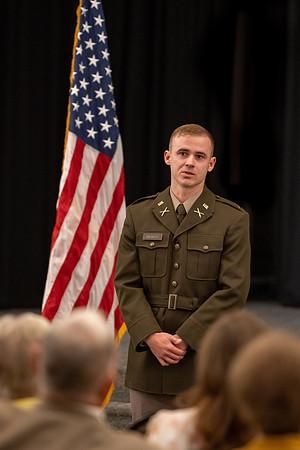 Four graduates from the BYU-Idaho ROTC program gather with the families and have a ceremonial commissioning.