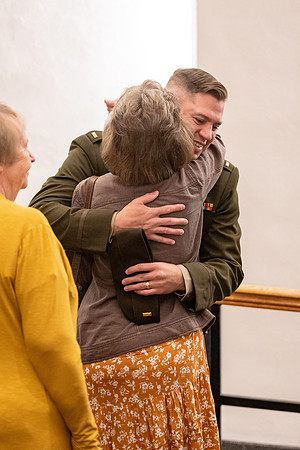 Four graduates from the BYU-Idaho ROTC program gather with the families and have a ceremonial commissioning.
