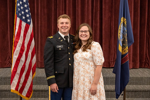 Four graduates from the BYU-Idaho ROTC program gather with the families and have a ceremonial commissioning.