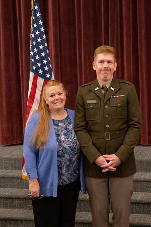 Four graduates from the BYU-Idaho ROTC program gather with the families and have a ceremonial commissioning.