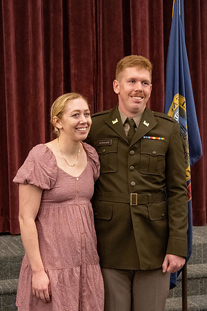 Four graduates from the BYU-Idaho ROTC program gather with the families and have a ceremonial commissioning.