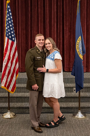 Four graduates from the BYU-Idaho ROTC program gather with the families and have a ceremonial commissioning.