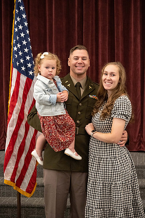 Four graduates from the BYU-Idaho ROTC program gather with the families and have a ceremonial commissioning.