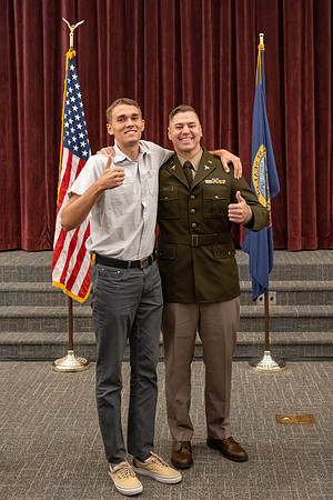 Four graduates from the BYU-Idaho ROTC program gather with the families and have a ceremonial commissioning.
