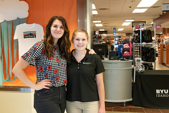 Student employees working at the pick up desk at the University Store since the store is closed to people walking through during the Covid-19 Pandemic.