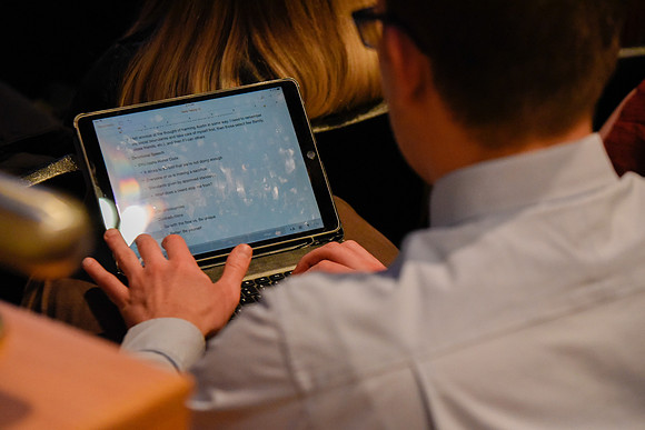 Student taking note at devotional