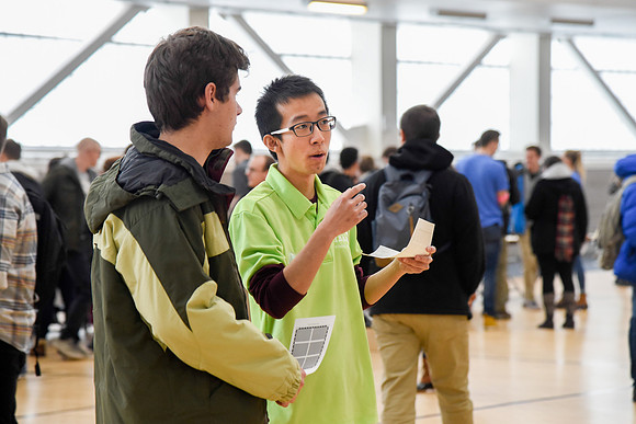 Michael Liao talks to a new student at the Get Involved Fair Winter 2018