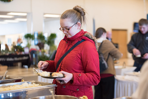 New students and their families getting together at the Crossroads enjoying some food. Jan 2018