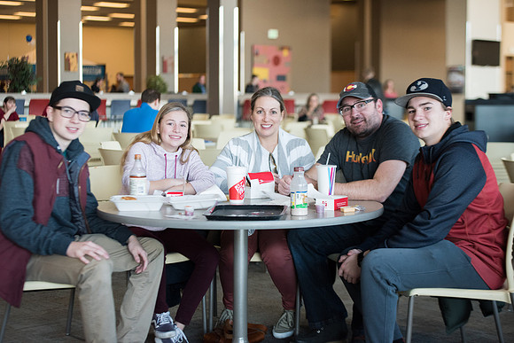 New students and their families getting together at the Crossroads enjoying some food. Jan 2018