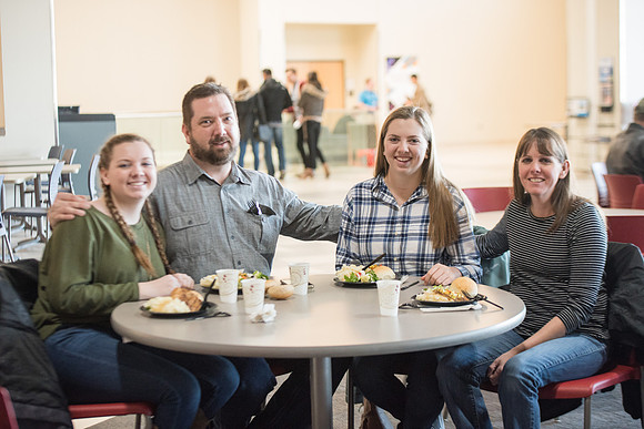 New students and their families getting together at the Crossroads enjoying some food. Jan 2018
