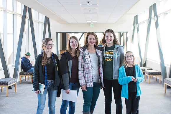 New students walking around campus with their families. Jan 2018