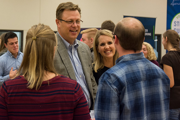 President and Sister Gilbert speak to students as they do a variety of service activies together with their dates.