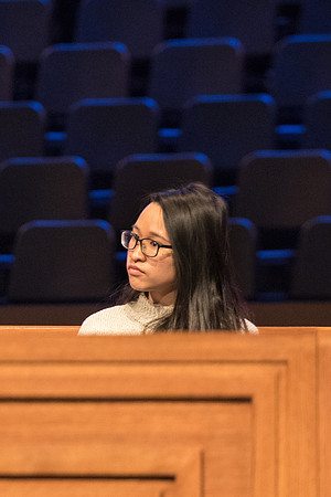 Victoria Lau sitted on the stage at Devotional.