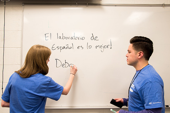 Student practices Spanish at the Conversation Lab.