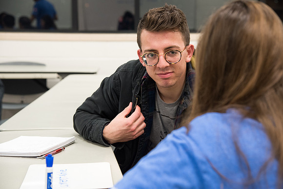 Student practices Spanish at the Conversation Lab.