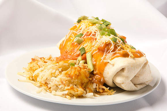 Hand wrapped Burrito, topped Green Chili Sauce, Shredded Cheese and Green Onions, Side of Hash Browns.