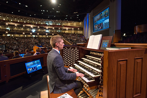 Organist plays prelude music setting the tone for a devotional with Elder Gary Stevenson.