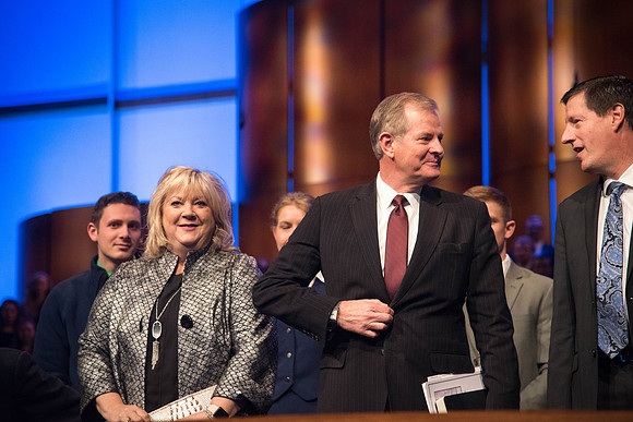 Elder and Sister Stevenson enter the I-Center at the start of Devotional.