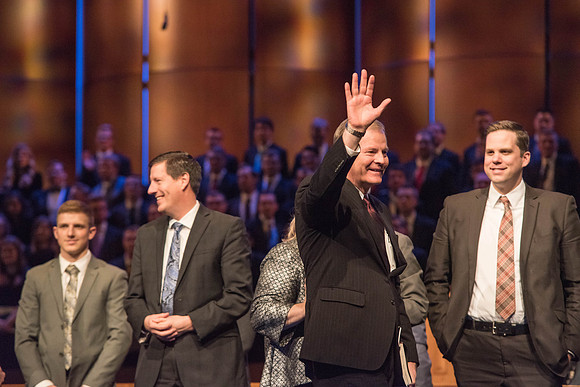 Elder Stevenson waves goodbye at the end of his Devotional talk. Photo by Garrett Blanchard.