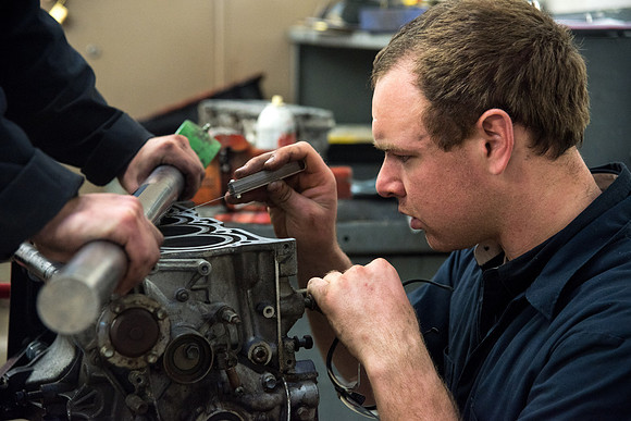 Students at the Internal Combustion Engine class that is taught by Brother Justin Miller.