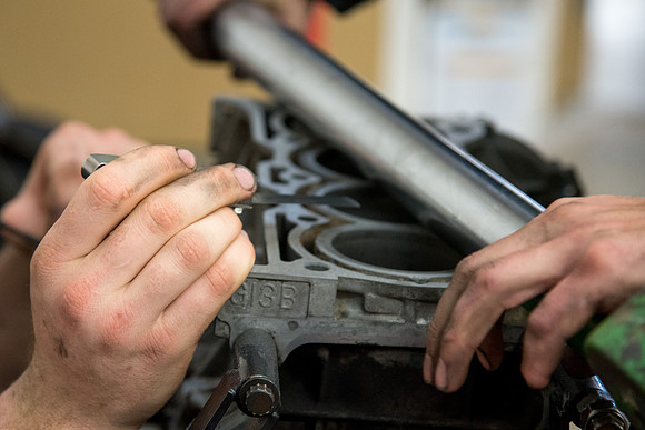 Students at the Internal Combustion Engine class that is taught by Brother Justin Miller.