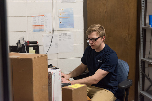 Students work in Mail Services getting packages organized and sent off to Centre Square apartments.