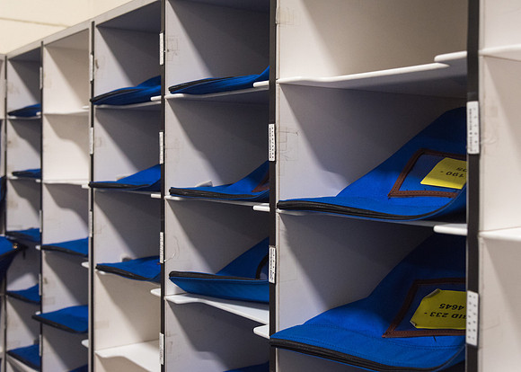 Sorted mail sits in the bins, waiting to be delivered.