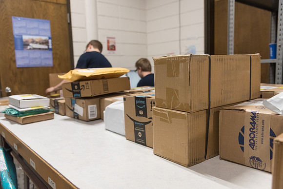 Students work in Mail Services getting packages organized and sent off to Centre Square apartments.