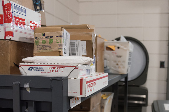 Students work in Mail Services getting packages organized and sent off to Centre Square apartments.