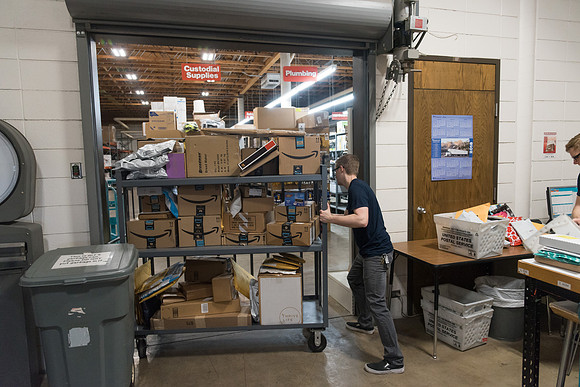 Students work in Mail Services getting packages organized and sent off to Centre Square apartments.