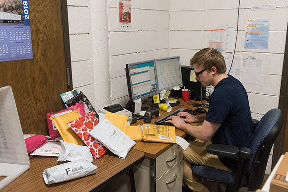Students work in Mail Services getting packages organized and sent off to Centre Square apartments.
