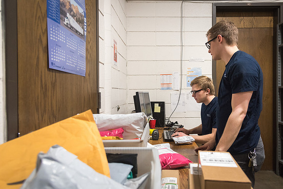 Students work in Mail Services getting packages organized and sent off to Centre Square apartments.