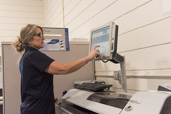 Jodee Boots, Mail Services Assistant, works in the mail room.