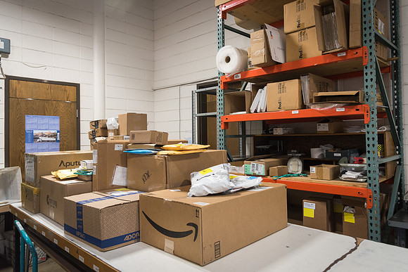 Students work in Mail Services getting packages organized and sent off to Centre Square apartments.