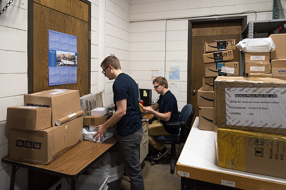 Students work in Mail Services getting packages organized and sent off to Centre Square apartments.