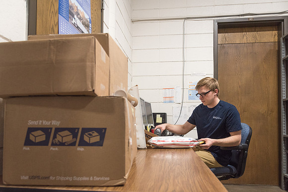 Students work in Mail Services getting packages organized and sent off to Centre Square apartments.