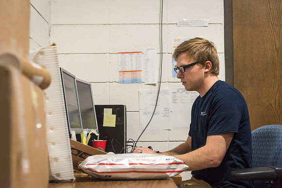 Students work in Mail Services getting packages organized and sent off to Centre Square apartments.