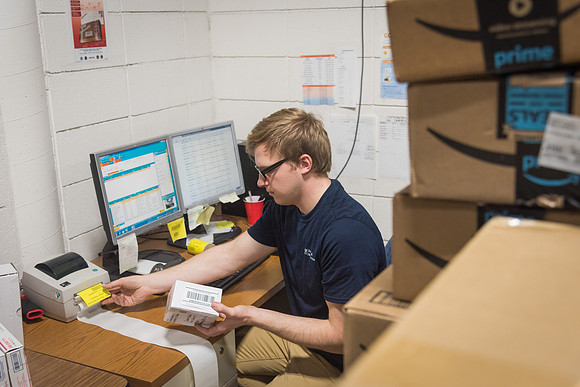 Students work in Mail Services getting packages organized and sent off to Centre Square apartments.