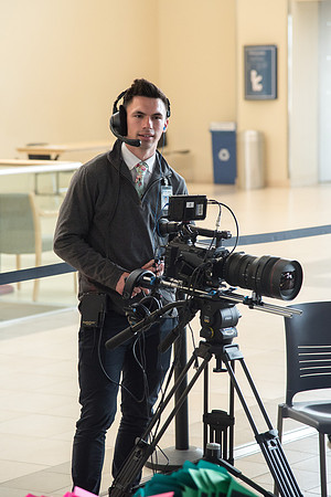 University Relation employees filming the conversation.