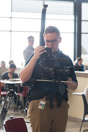 University Relation employees filming the conversation.