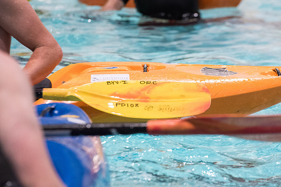 Students for a weekly gathering in the Hart pool to practice kayaking.