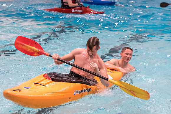 Students for a weekly gathering in the Hart pool to practice kayaking.