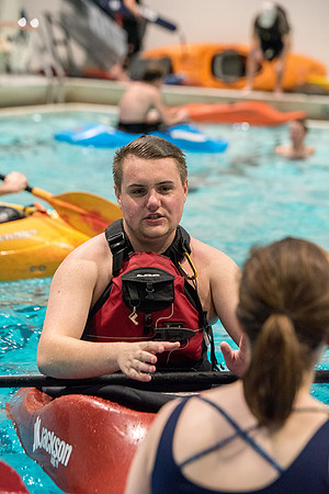 Students for a weekly gathering in the Hart pool to practice kayaking.